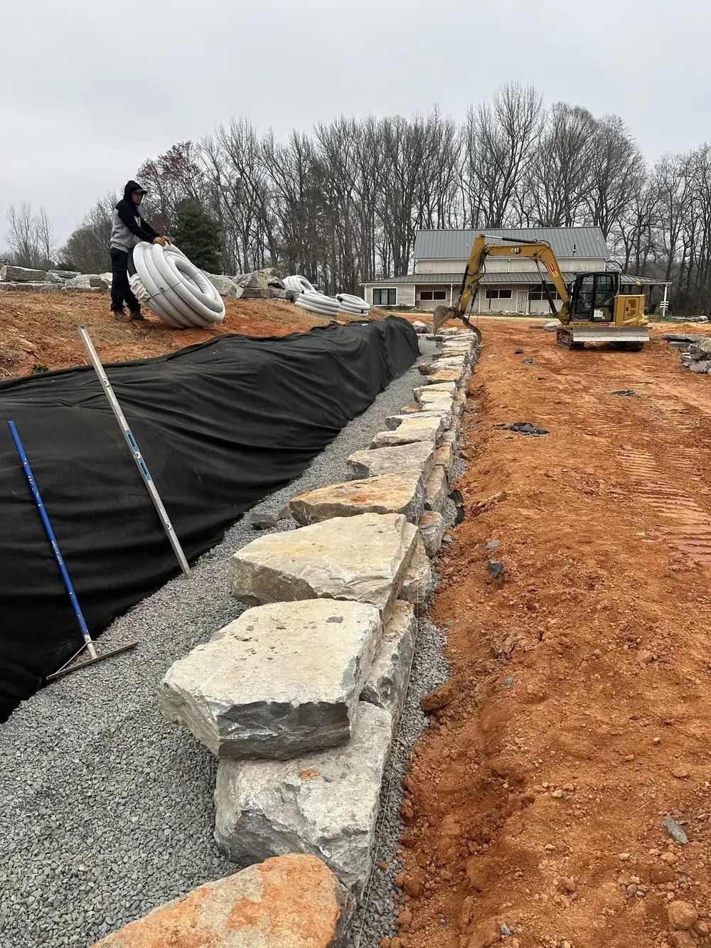 Stone and filter fabric set along a slope